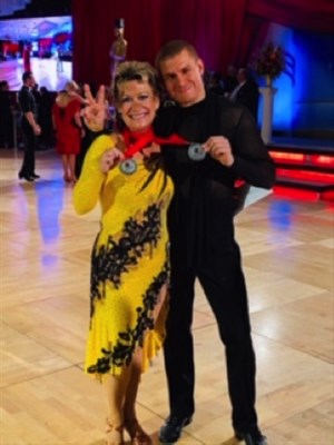 Janet Foy and her dance instructor partner Igor Puzhevich, winning second place at the International Rhythm Championship.